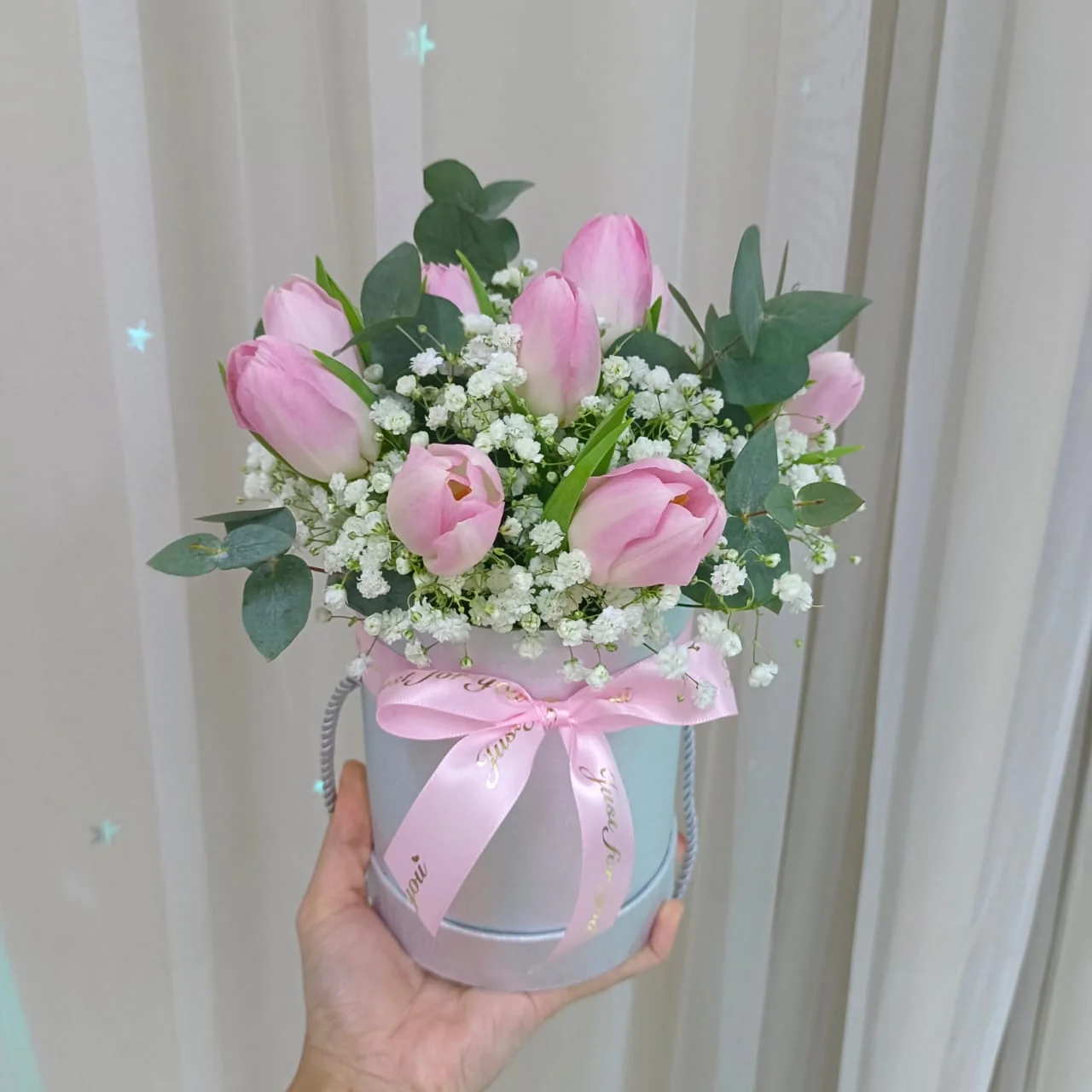 Soft pink tulips arranged in a flower box by Nieldelia